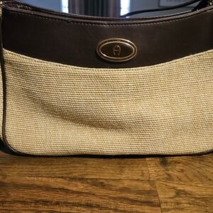 Etienne Aigner vintage woven jute shoulder bag with brown leather trim.